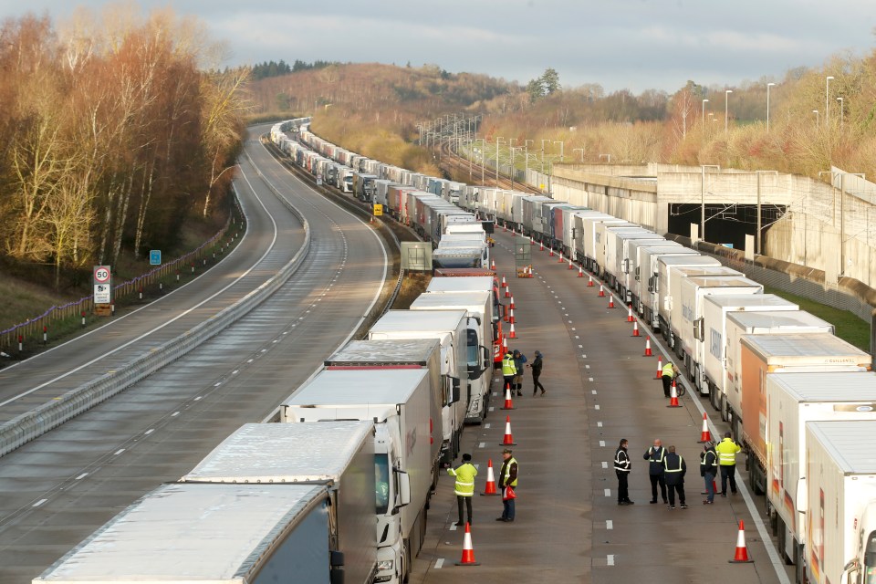 Services personnel move down the lines of lorries 