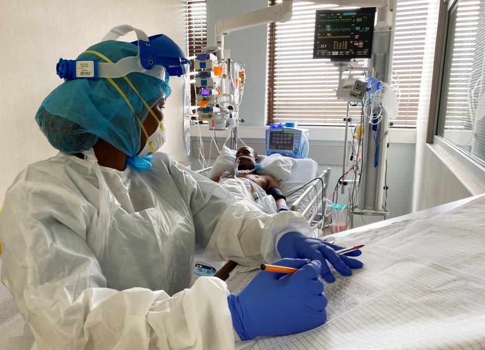 A medic attends to a Covid patient at a special ward in Arwyp Medical Centre, South Africa