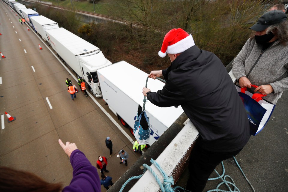 Thoughtful locals used a rope to send deliveries down to people trapped on the M20