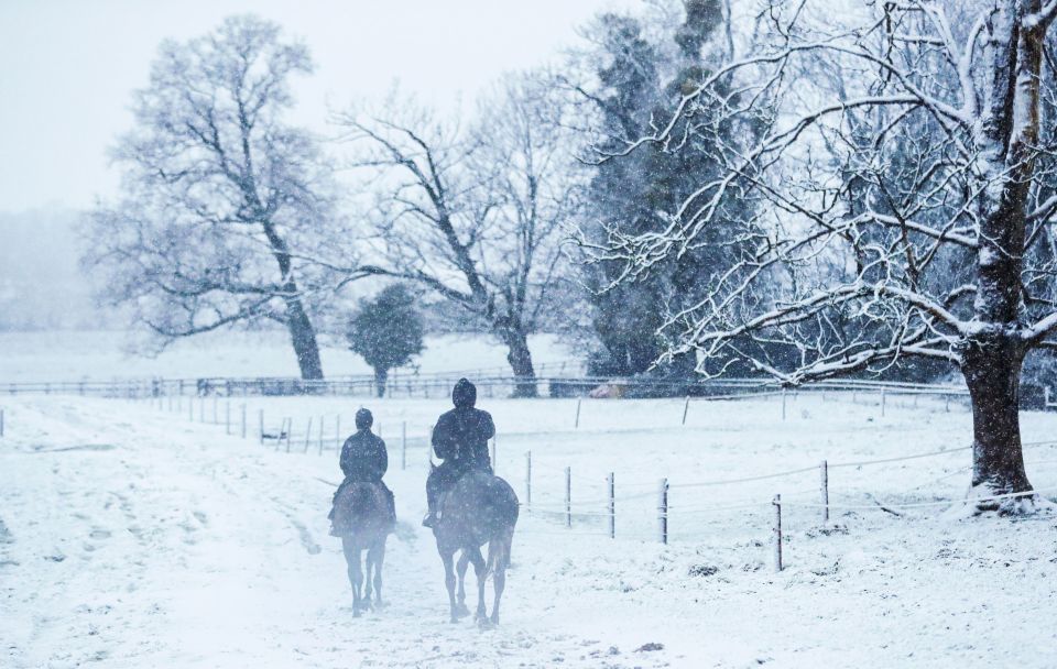 A pair of horse riders enjoy a morning hack in Upper Strensham, Worcester