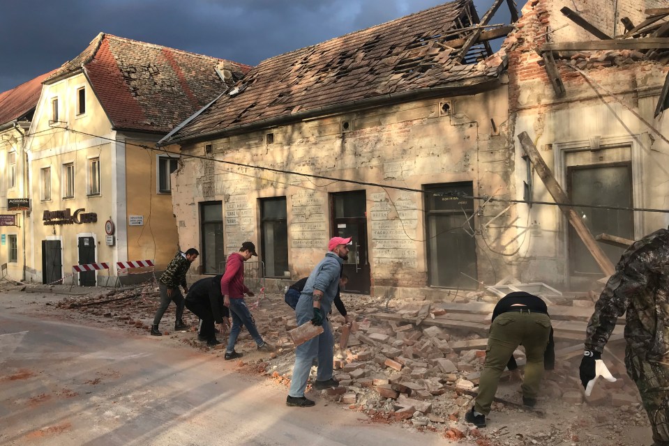 Clean up crews move rubble in Petrinja