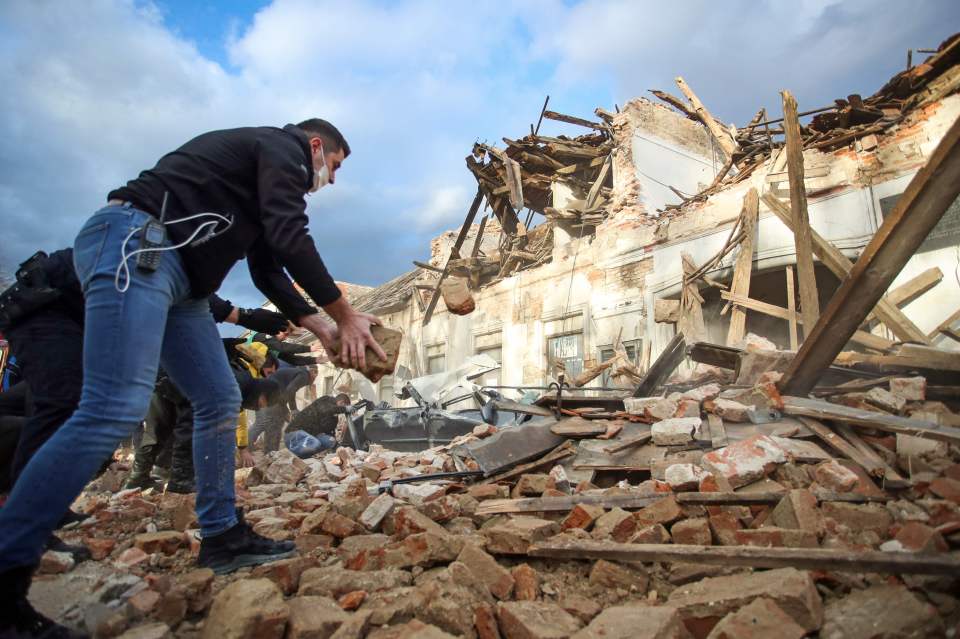 Locals sift through rubble following the quake