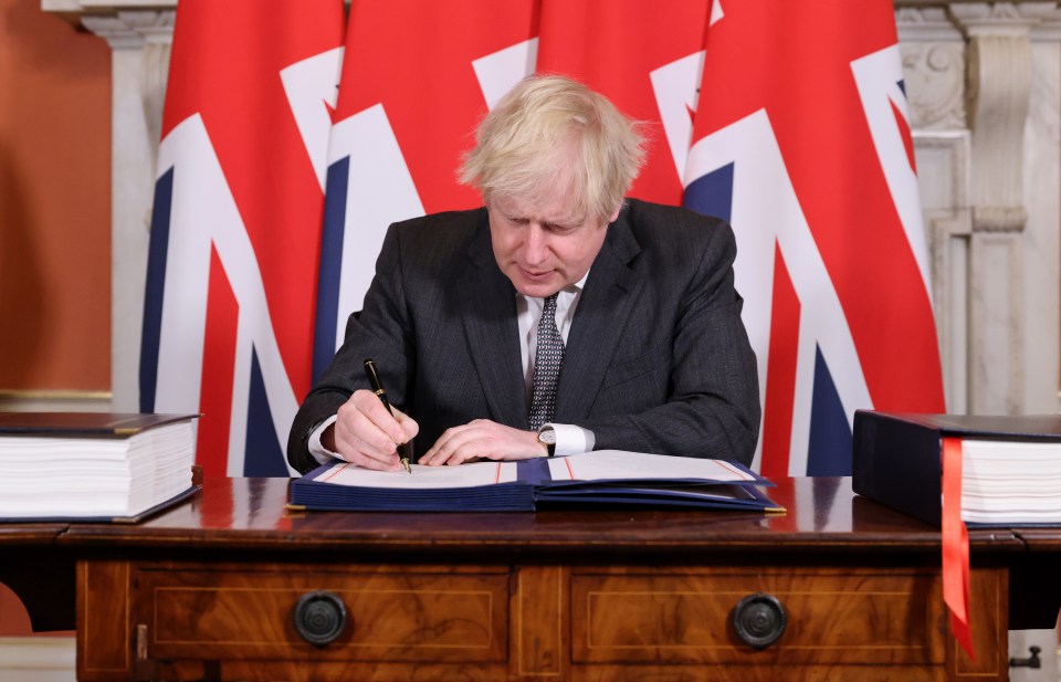 Boris Johnson signing the Brexit deal