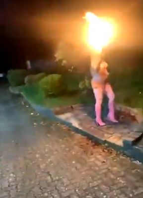 A flame thrower is seen at at Chingford party celebrating the end of 2020