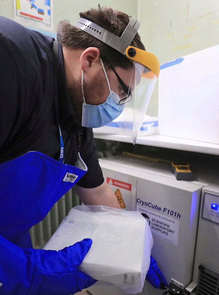 A pharmacy technician from Croydon Health Services prepares to store the first delivery of COVID-19 vaccine, at Croydon University Hospital in Croydon, December 5