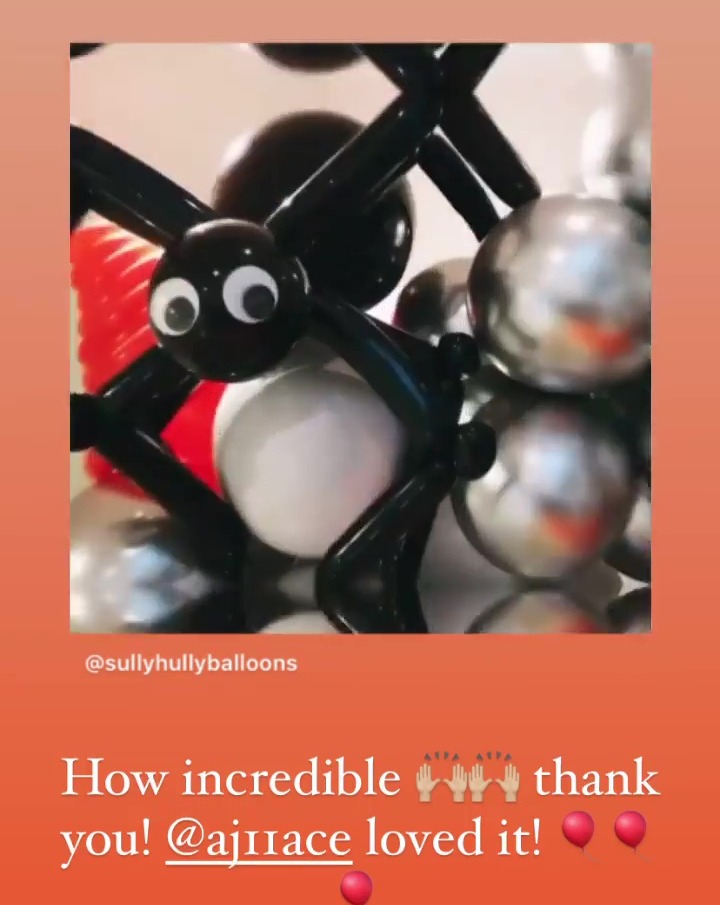 She even completed the scene with balloon spiders