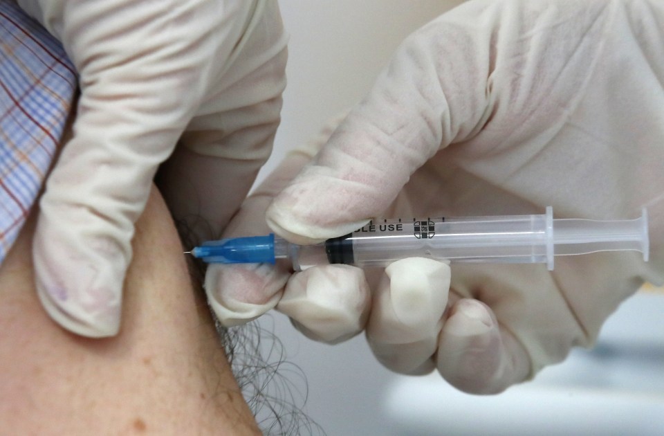 Millions may avoid coronavirus vaccination in fear of needles. Pictured: A medical worker injects a man with a vaccine against Covid-19 in Russia