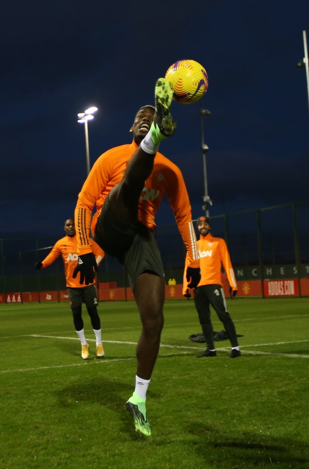 Paul Pogba stretches for the ball in training after his agent's controversial comments