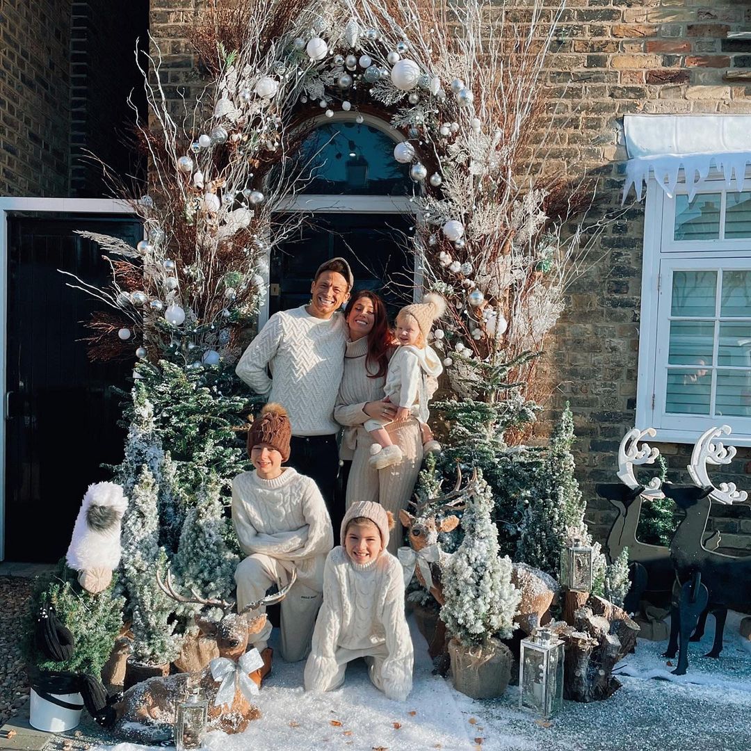 Stacey Solomon posed outside her home with Joe Swash and her boys