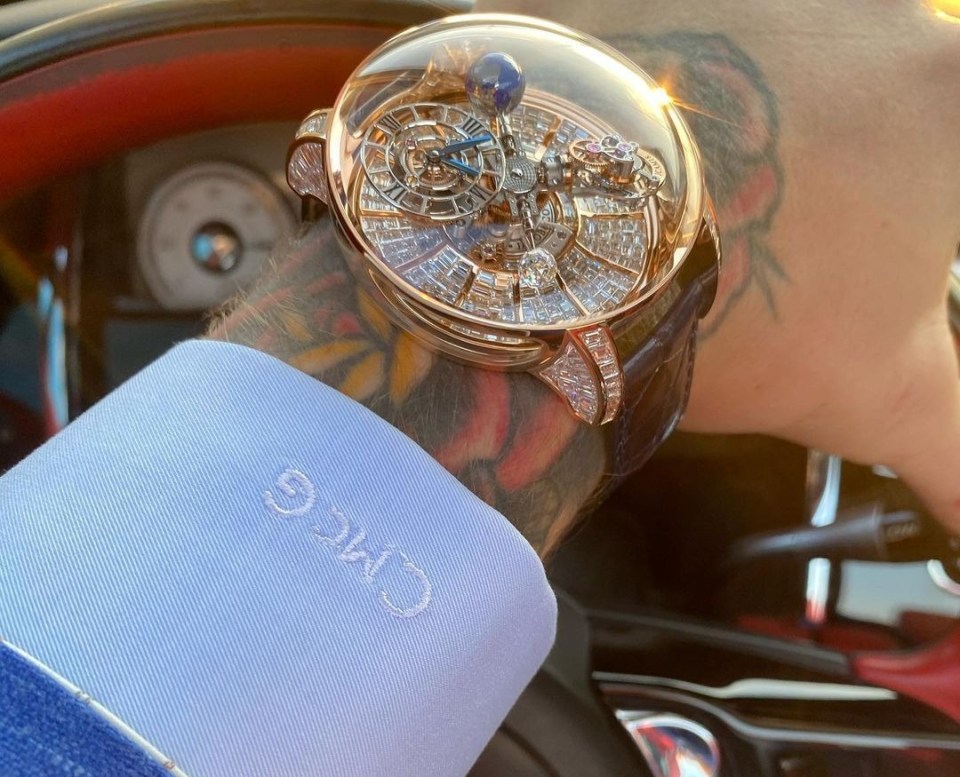 McGregor – wearing a new custom-made suit – also showed off his £730k Jacob & Co Astronomia Tourbillon Baguette watch