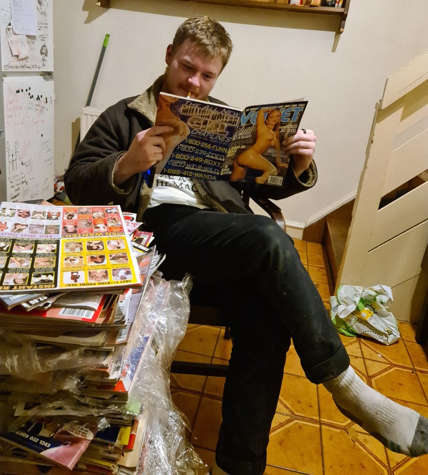 Daniel Sims, 32, with the vintage porn stash found in his attic