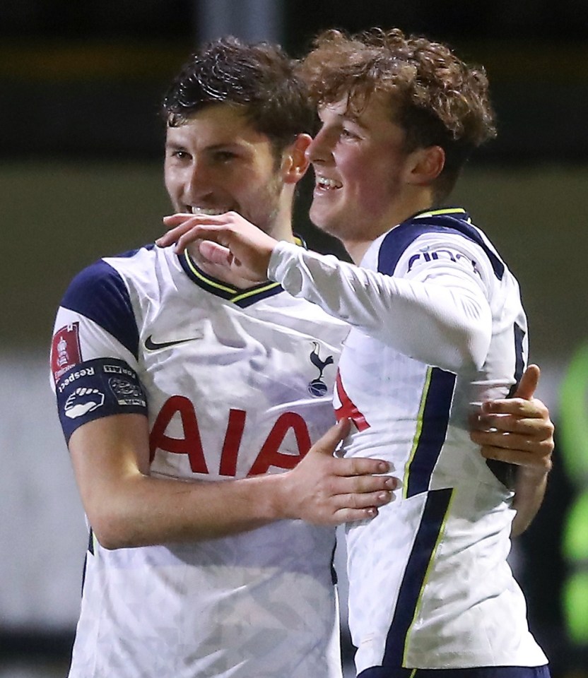 Alfie Devine is congratulated by Ben Davies for becoming Spurs' youngest ever goalscorer