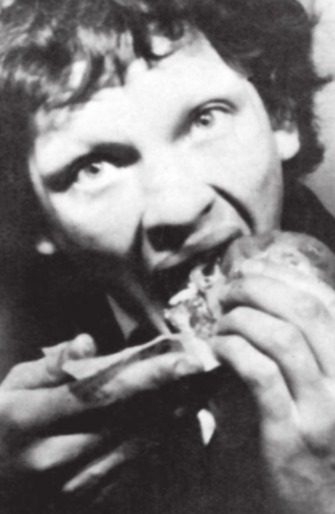 Serial killer Patrick Mackay wolfs down chicken in a photobooth after killing Catholic priest Father Anthony Crean