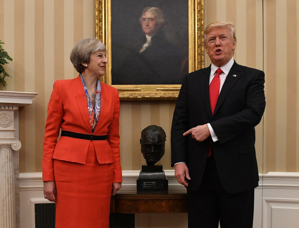 Donald Trump points to the bust of Churchill during a meeting with Theresa May