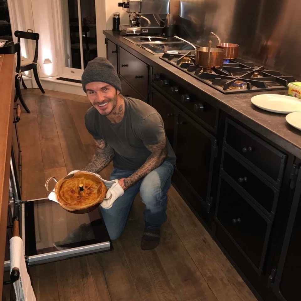 The Beckhams have taken on a number of domestic staff – yet they don’t shy away from doing chores themselves. Above, David poses with a chicken and leek pie