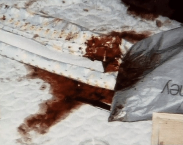 The bloody bed of Whitney Bennett, after he beat her with a metal wheel brace