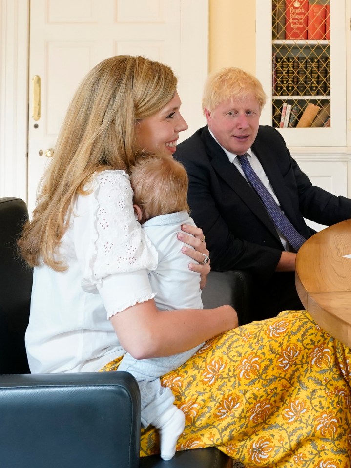 Prime Minister Boris Johnson and his partner Carrie Symonds with their son Wilfred in the study of No10 Downing Street 