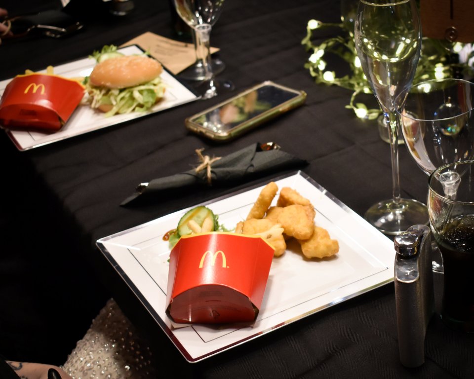 Guests at Melissa and Shannon's wedding tucked into nuggets and fries at their reception