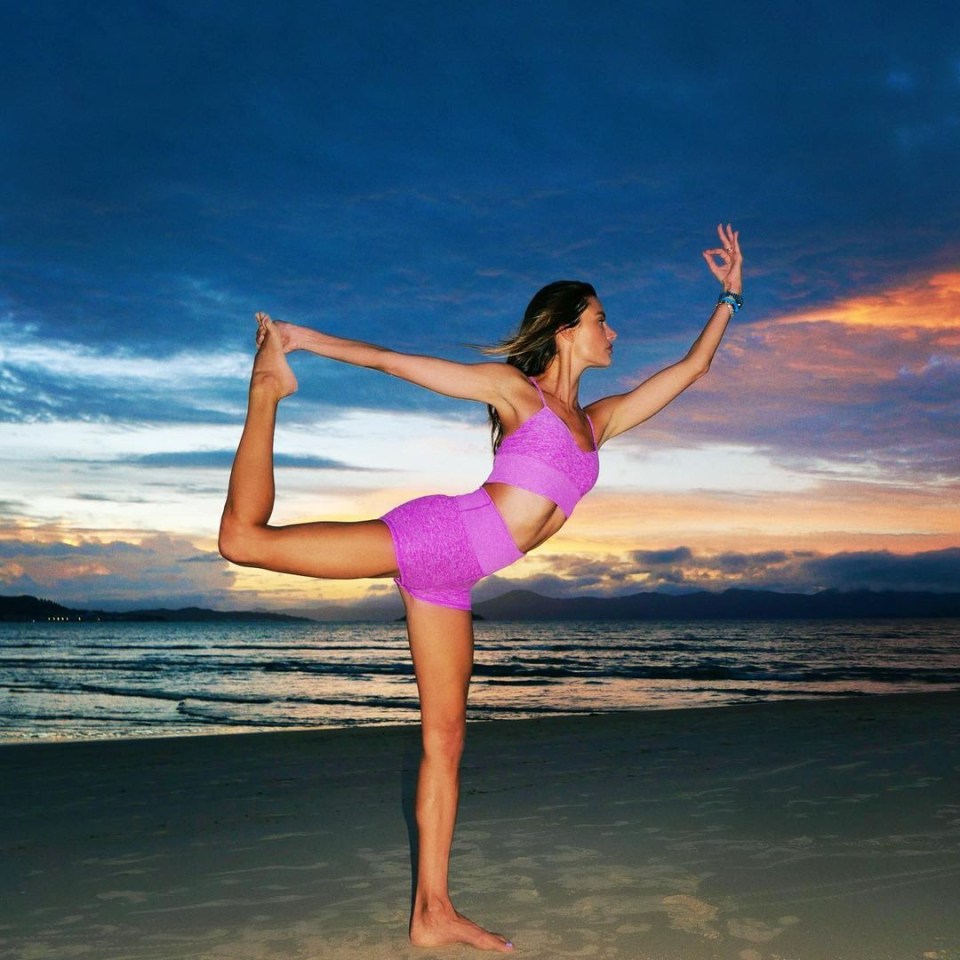 Alessandra, 39, holds dancer's pose during yoga practice