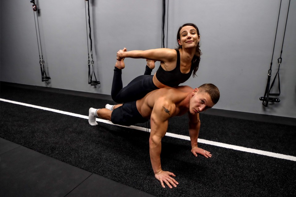 Matt shows off his strength by giving Sarah a lift