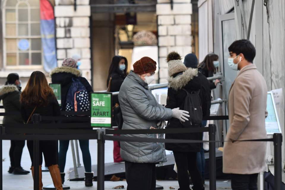 People queue this week at an NHS vaccination centre in London