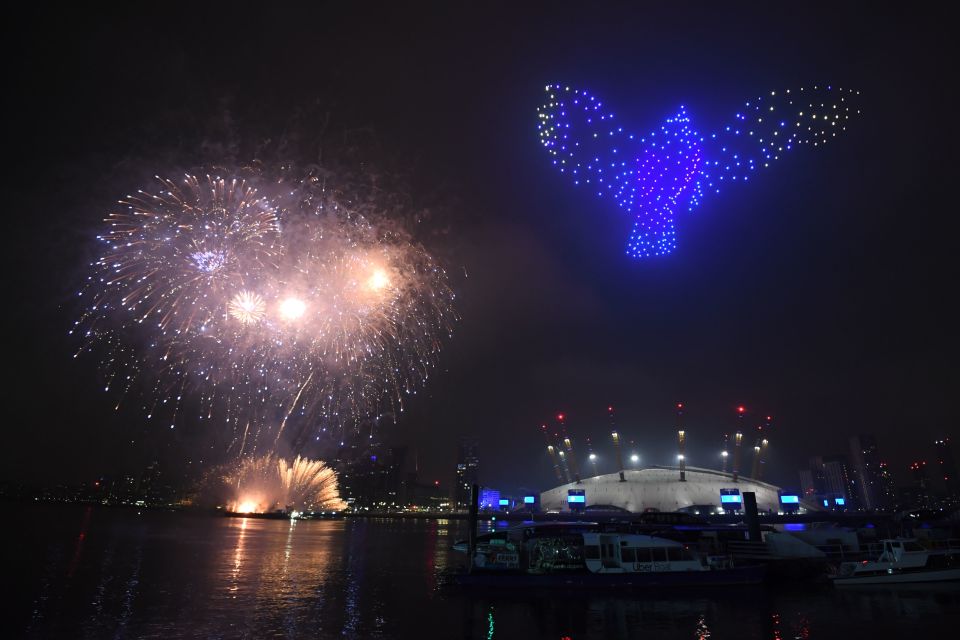 Fireworks and drones illuminate the night sky over London as they form a light display as London's normal New Year's Eve fireworks display was cancelled due to the coronavirus pandemic