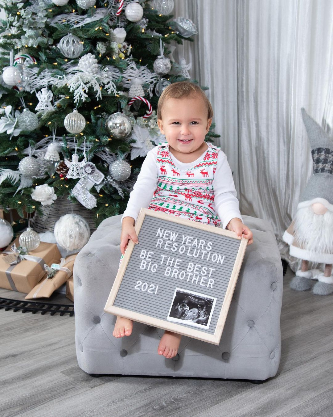 Mrs Hinch announced her pregnancy on New Year's Day by sharing an adorable snap of Ronnie under the Christmas tree