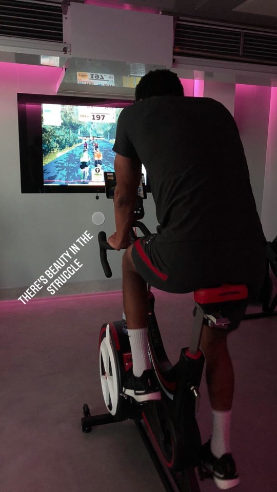 The defender shared a shot of himself on an exercise bike as he continues his rehab