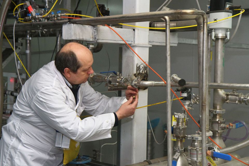 An International Atomic Energy Agency (IAEA) inspector checks uranium levels at an Iranian plant