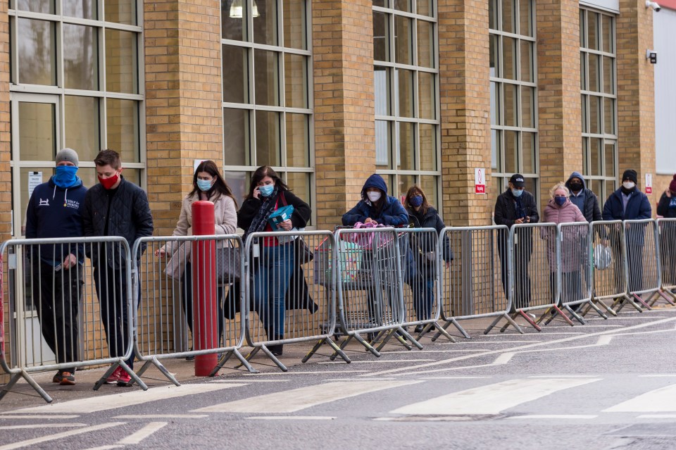 Shoppers queued outside Costco in Watford this morning on the first day of England's new lockdown