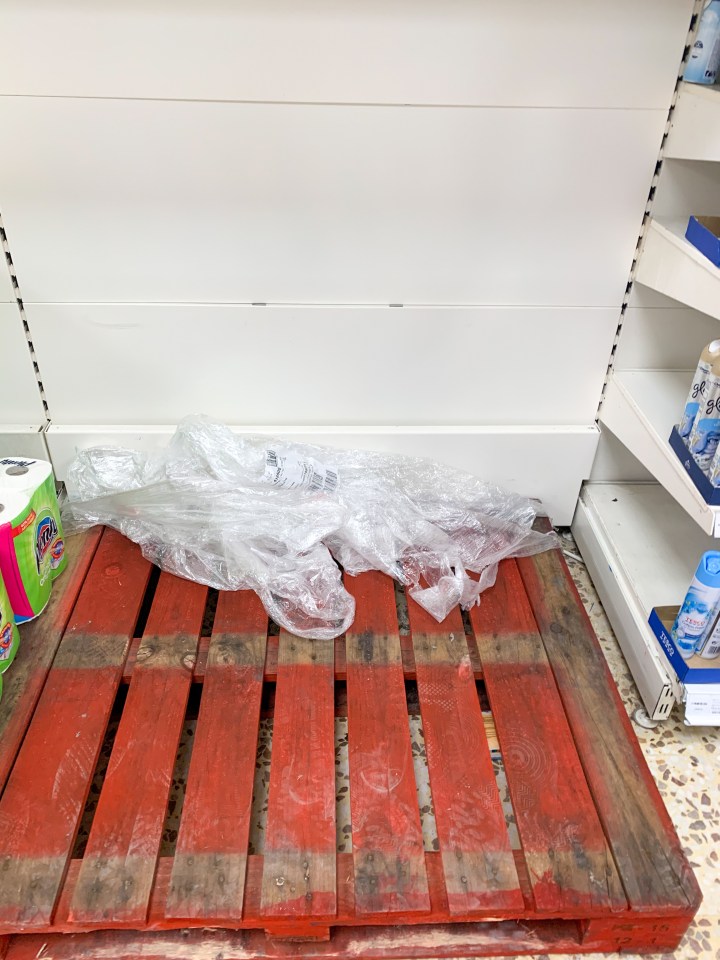 Empty loo paper shelves in Tesco in Huntingdon, Cambridgeshire