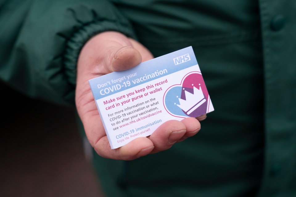 An NHS card shows whether people have had the vaccine