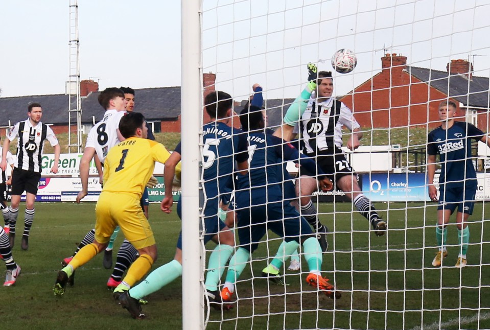 Striker Connor Hall heads Chorley in front early on as the sixth-tier side made history with a 2-0 win over Derby