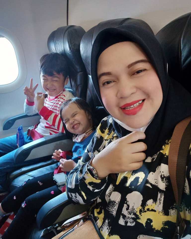 Mum Rathi Windania seen on an earlier trip with her children 