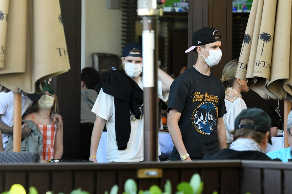 Cruz and Romeo both wore t-shirts and caps for the outing