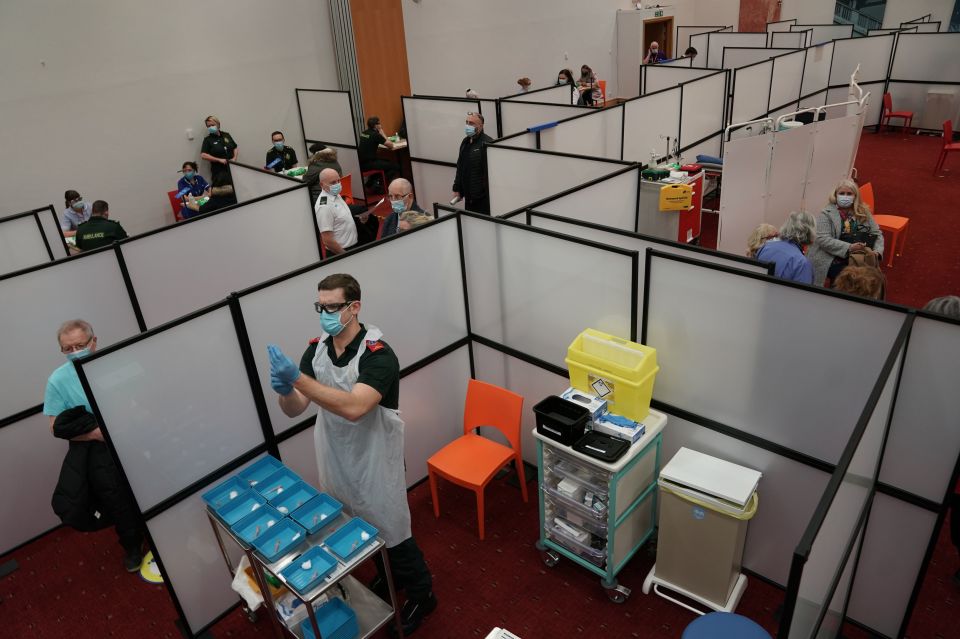 A healthcare workers at the NHS vaccine centre in Newcastle, one of the seven mass vaccination centres that are now open