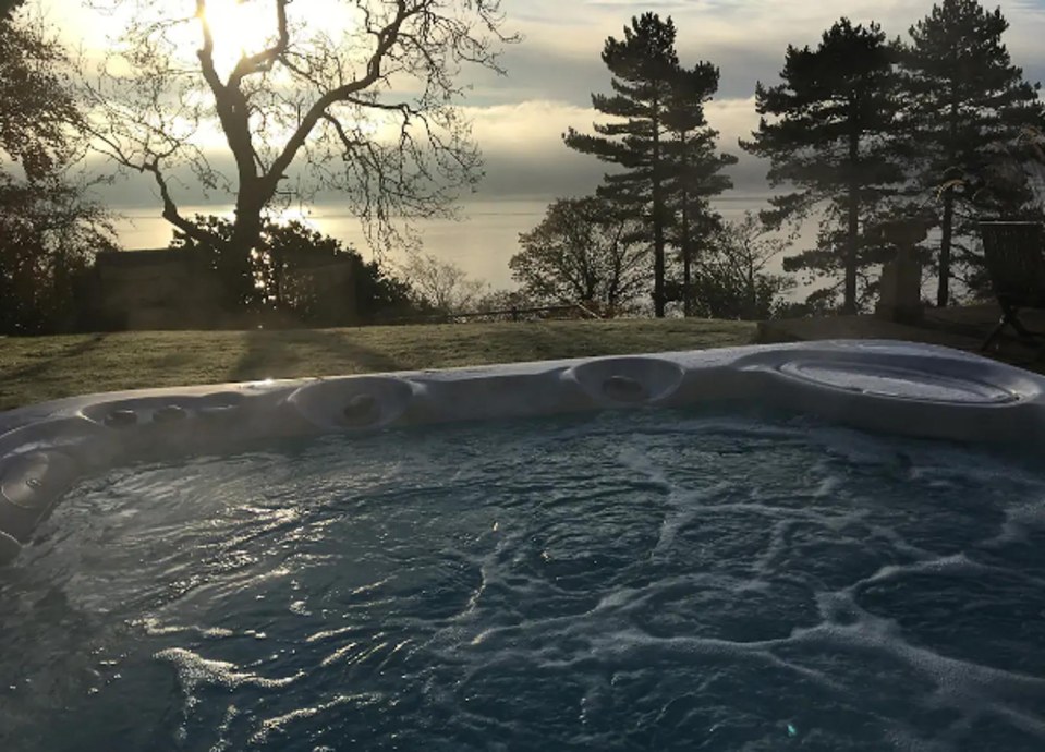 Unwind in a bubbling hot tub with coastal views