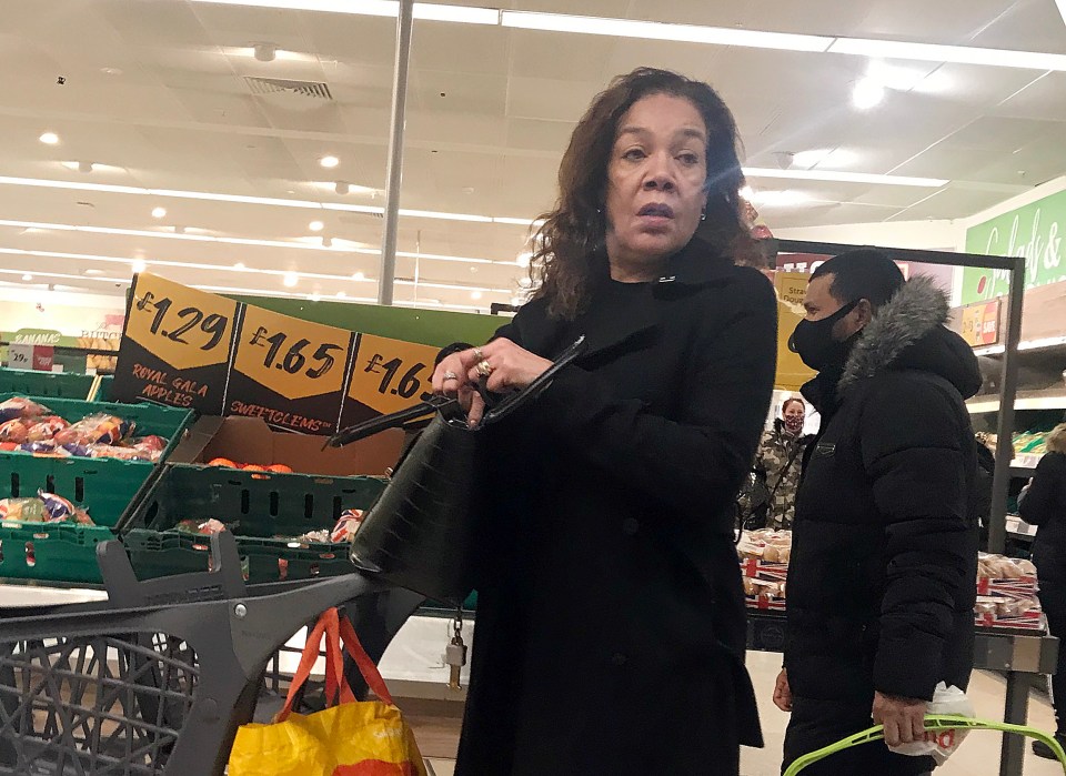 A woman is seen at a Morrisons in South London not wearing their mask