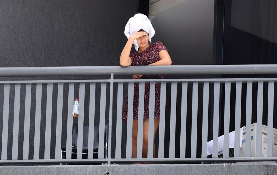 The UK government is considering forcing new visitors to isolate in hotels. A woman is pictured quarantining at a hotel in Brisbane, Australia