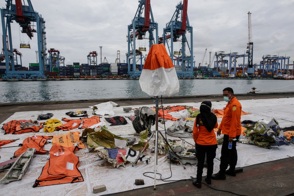 Debris is collected on the dock near Jakarta today