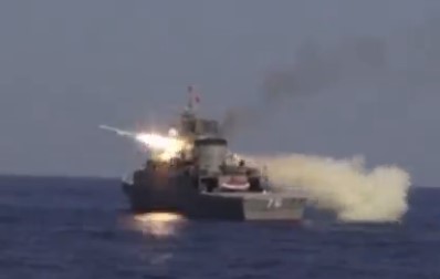 Video footage shows missiles and torpedoes blasting into the Gulf of Oman