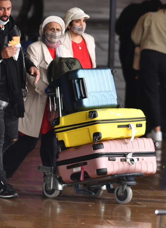 Families with suitcases piled high made their way home to Britain 