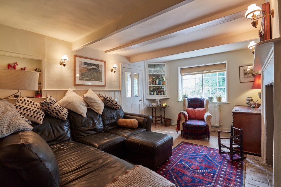 The sitting room also has the pub's original fire surround and is half panelled