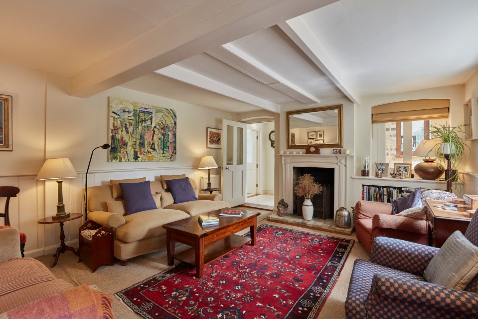 The building's original beams can be seen in the living room and the low ceilings make for cosy nights in 