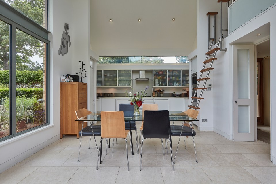 The quirky step ladder in the kitchen leads to a mezzanine level that overlooks the beautiful garden