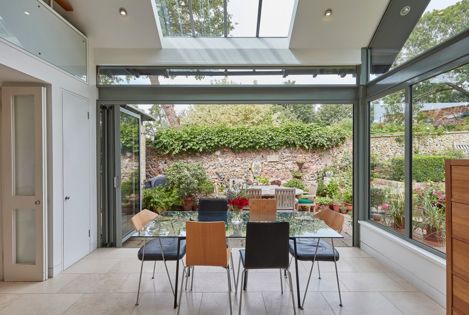 The stunning glass walls let the light flow into the building's kitchen 