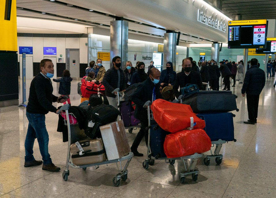 Returning travellers were not social distancing arriving back at Heathrow