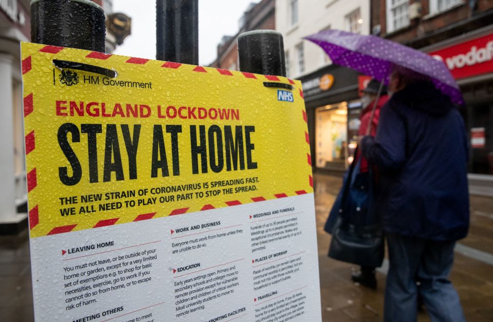 A Government sign warning people to stay at home on the High street in Winchester, Hampshire