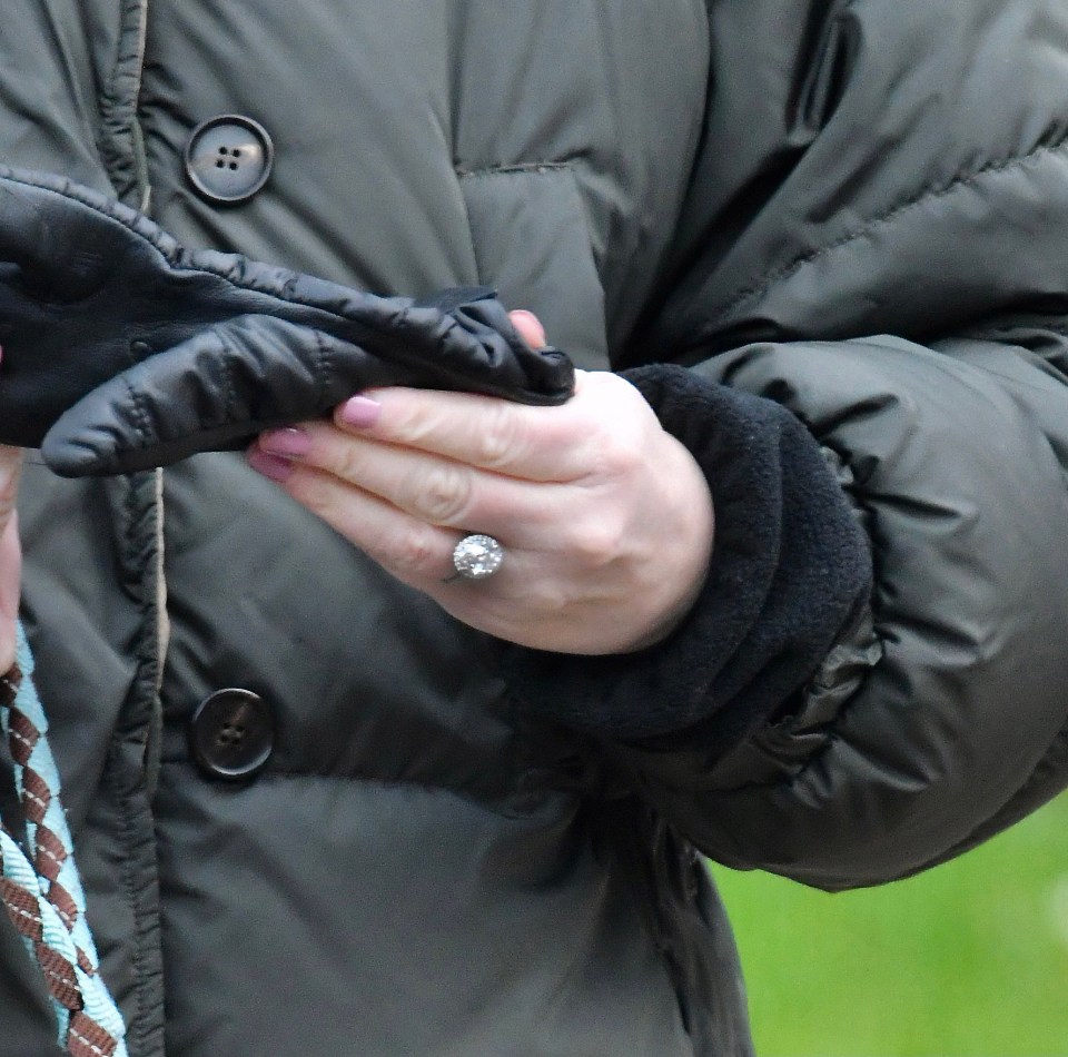 She's wearing a four-carat diamond halo ring