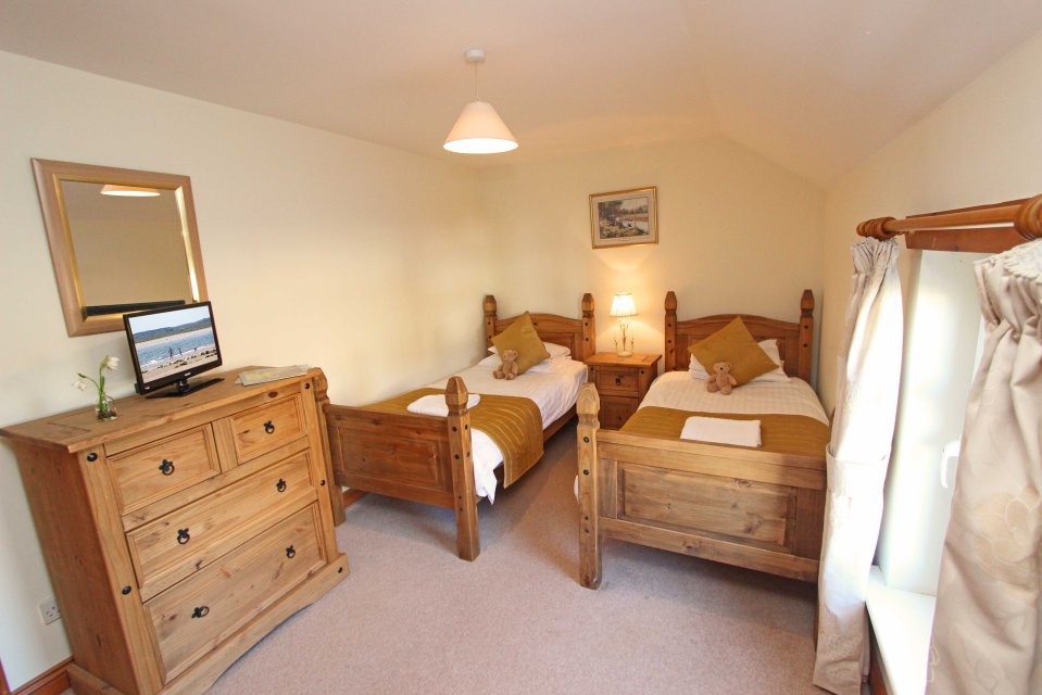 Ferguson Cottage in Warenford village sleeps six plus one dog and features three ensuite bedrooms and a spacious kitchen-diner as well as lounge with TV and free wifi